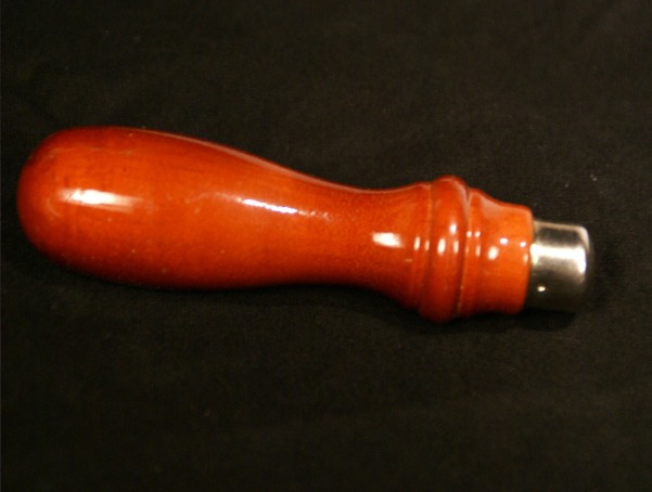 Durable wood tool handle with a metal ferrule for reinforced strength, available in bulk.